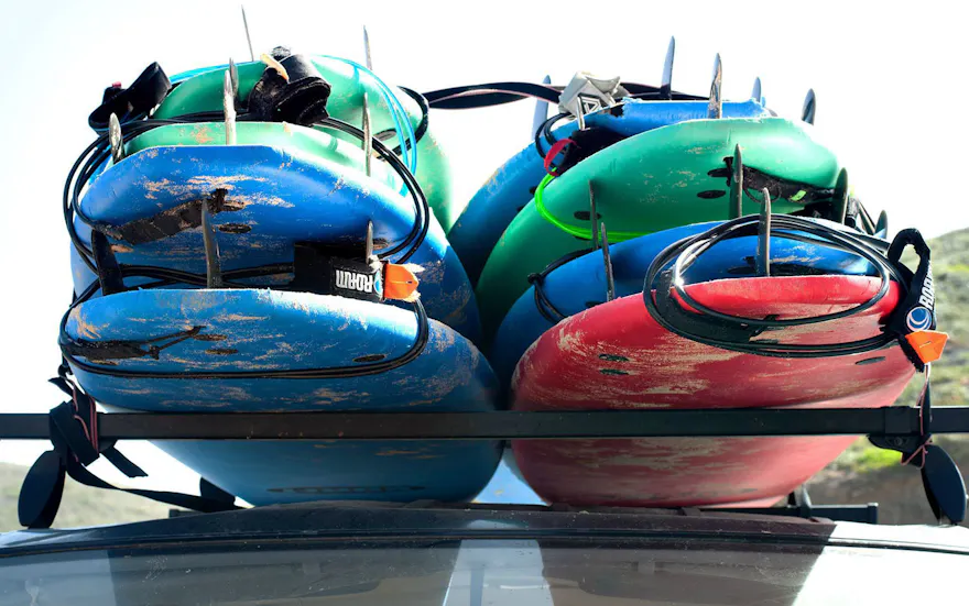 Surf boards loaded onto van