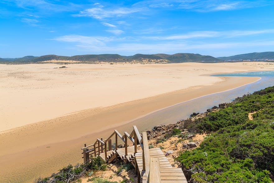 Wooden walkway to sandy Praia do Bordeira, Algarve, Portugal