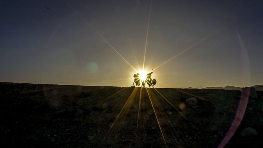 Bike silhouetted against the sunrise