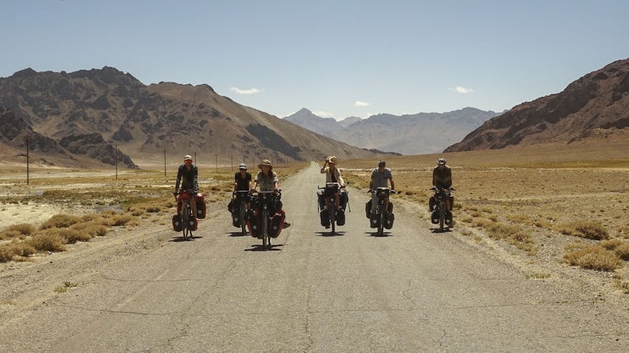A group of cyclists in the desert
